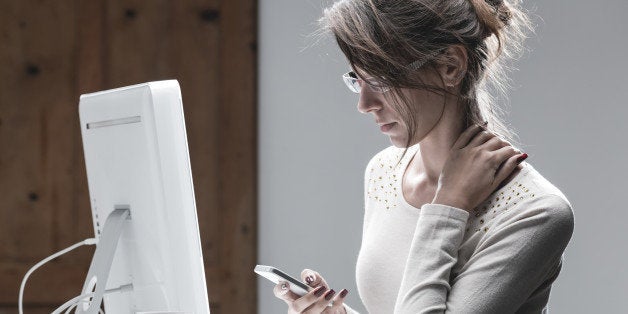 Shoot in studio, wearing eyeglasses, in front of computer, elegant red polish nails