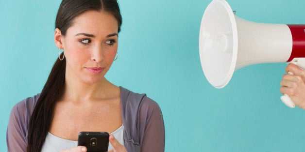 Studio shot of woman texting