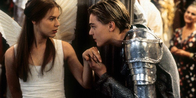 Claire Danes is surprised as Leonardo DiCaprio takes her hand to kiss in scene from the film 'Romeo + Juliet', 1996. (Photo by 20th Century-Fox/Getty Images)