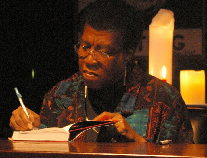 Description Octavia Estelle Butler signing a copy of Fledgling after speaking and answering questions from the audience. The event was ... 