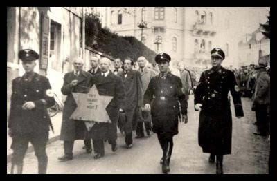 Description 1 Jews are being forced to walk with the star of David during the Kristallnacht in Nazi-Germany in the night of 9-10 november ... 