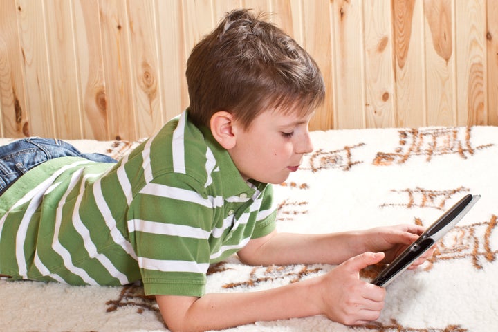 teenager boy lying on the bed...