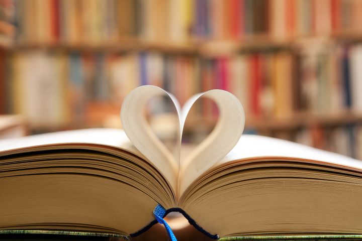 book page in heart shape with...