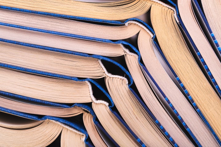 stack of open books close up