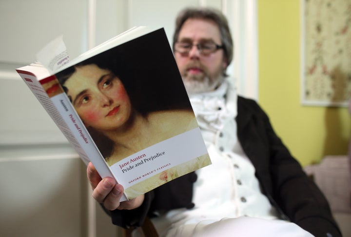 BATH, ENGLAND - JANUARY 28: A reader waits as part-time actor Ashley Green (not seen) reads chapter ten of Jane Austen's Pri