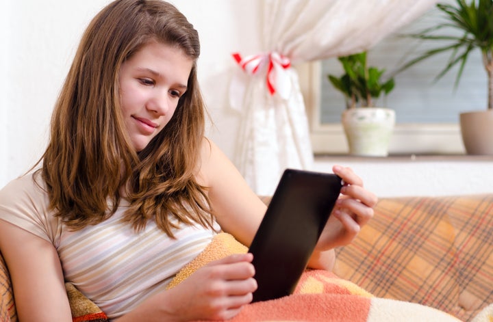 cute teenage girl reading...