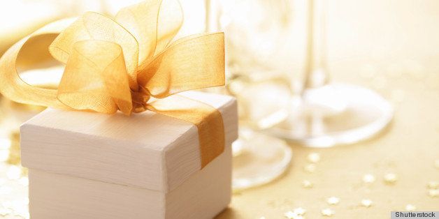 gift box tied with a gold ribbon bow