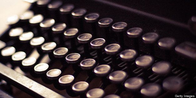 The keys of a black vintage typewriter.