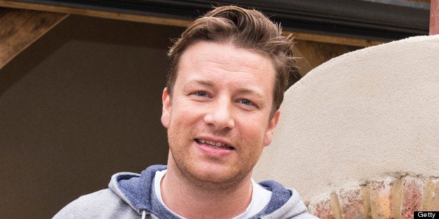 LONDON, ENGLAND - MAY 20: Jamie Oliver makes and cooks a pizza in a stone oven at the Chelsea Flower Show press and VIP preview day at Royal Hospital Chelsea on May 20, 2013 in London, England. (Photo by Mark Cuthbert/UK Press via Getty Images)