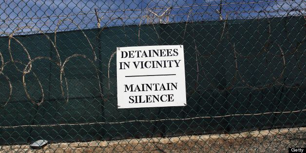 GUANTANAMO BAY, CUBA - SEPTEMBER 15: (EDITORS NOTE: Image has been reviewed by the U.S. Military prior to transmission.) A sign hangs on a perimeter fence at the detention center for 'enemy combatants' on September 15, 2010 in Guantanamo Bay, Cuba. With attempts by the Obama administration to close the facility stalled, more than 170 detainees remain at the detention center, which was opened by the Bush administration after 9/11. The facility is run by Joint Task Force Guantanamo, located on the U.S. Naval Station at Guantanamo Bay on the coast of southeastern Cuba. (Photo by John Moore/Getty Images)