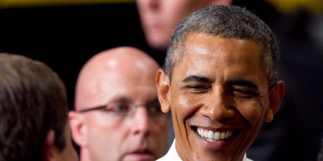 CHATTANOOGA, TN - JULY 30: U.S. President Barack Obama greets people after making a speech about the economy and jobs at an Amazon.com Fulfillment Center July 30, 2013 in Chattanooga, Tennessee. Obama proposed a corporate tax reform that will use billions of dollars in revenues generated by a business tax to create jobs. Amazon announced this week that it expects to have 7,000 job openings across the country. (Photo by Jessica McGowan/Getty Images)