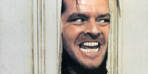 Jack Nicholson peering through axed in door in lobby card for the film 'The Shining', 1980. (Photo by Warner Brothers/Getty Images)