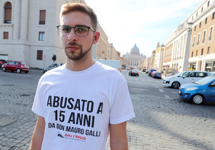 Italian Abuse victim Alessandro Battaglia wears a t-shirt that says, "Abused when I was 15 by father Mauro Galli" as he demonstrates near Saint Peter's Basilica in Rome, Italy, October 3, 2018.