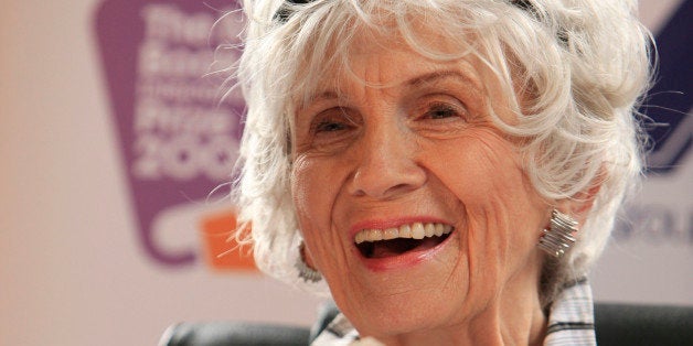 Canadian author Alice Munro holds one of her books as she receives her Man Booker International award at Trinity College Dubl