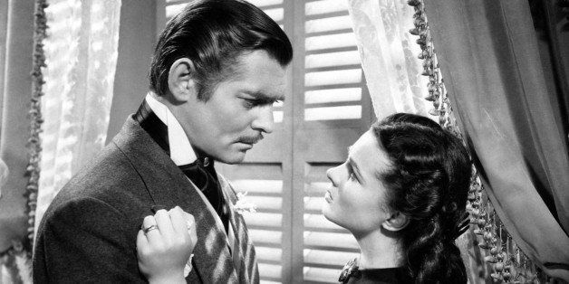 Actor Clark Gable, as Rhett Butler, and Vivien Leigh, as Scarlett O'Hara, passionately look at each other in a scene from the movie Gone with the Wind by Victor Fleming. United States, 1939. (Photo by Mondadori Portfolio via Getty Images)