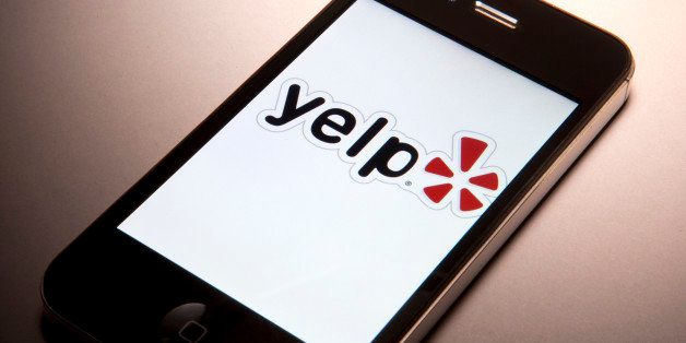 The Yelp Inc. logo is displayed on a mobile device for a photograph in New York, U.S., on Thursday, March 1, 2012. Yelp Inc., the site that lets users review everything from diners to dentists, is set to price it's IPO tonight and could potentially raise as much as $100 million, which would value the company at about $838 million. Photographer: Scott Eells/Bloomberg via Getty Images