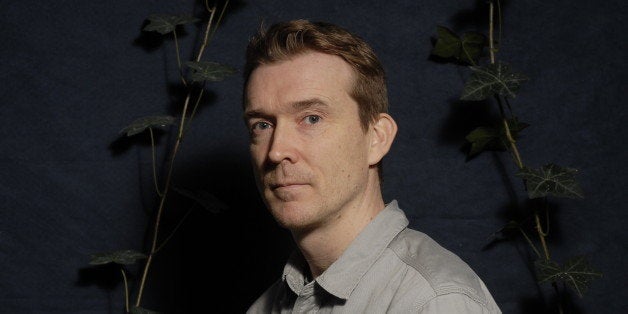 PARIS, FRANCE - DECEMBER 14: English writer David Mitchell poses during a portrait session held on December 14, 2011 in Pari