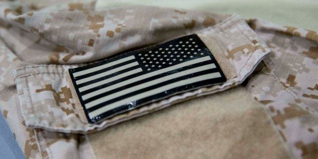 In this Sept. 5, 2014 photo provided by the National September 11 Memorial and Museum, a detail of the fatigue shirt showing
