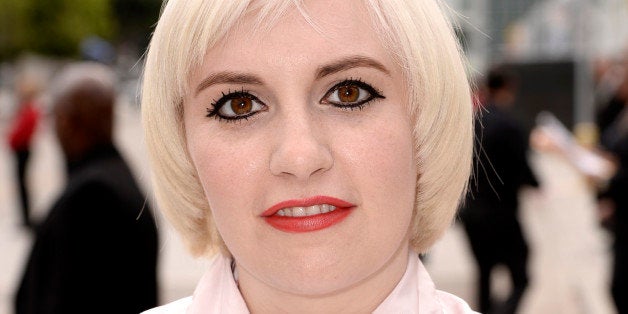 Lena Dunham arrives at the 66th Primetime Emmy Awards at the Nokia Theatre L.A. Live on Monday, Aug. 25, 2014, in Los Angeles. (Photo by Dan Steinberg/Invision for the Television Academy/AP Images)