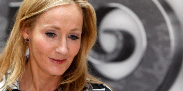 British author J.K. Rowling looks on as she poses for photographers during a photo call for her new website project Pottermor