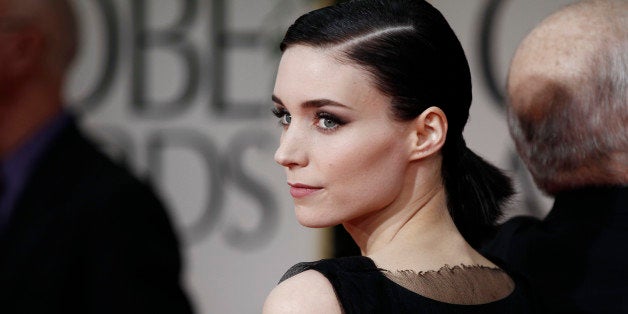 Rooney Mara arrives for the 69th Annual Golden Globe Awards Sunday, Jan. 15, 2012, in Los Angeles. (AP Photo/Matt Sayles)
