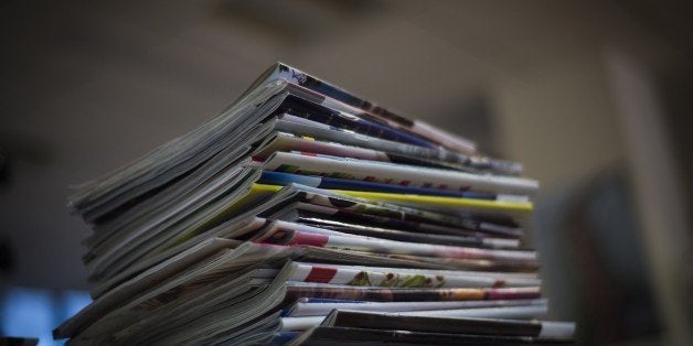 A picture taken on January 14, 2015 in Paris, shows a pile of magazines. AFP PHOTO / MARTIN BUREAU (Photo credit should read MARTIN BUREAU/AFP/Getty Images)