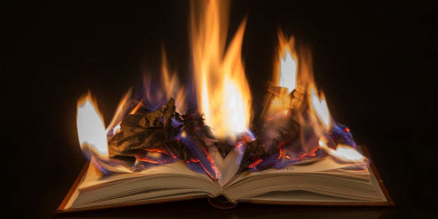 Open book with burning pages