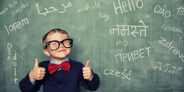 A young language master boy knows how to say hello in many different languages. All languages and cultures are beautiful.