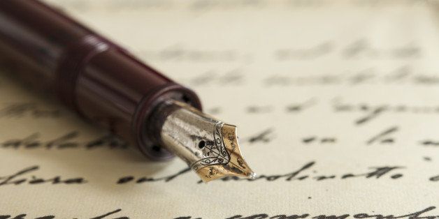 an old fountain pen on a manuscript