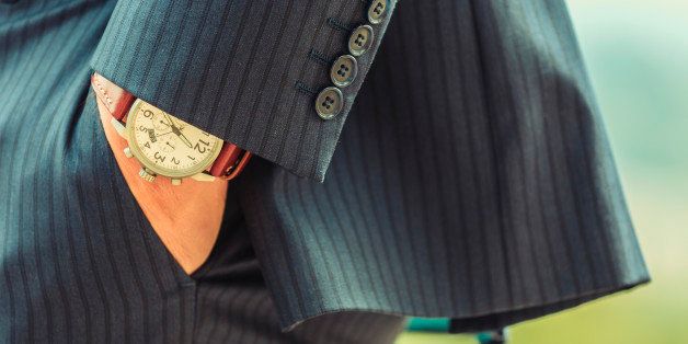 Close up of hand in pocket of Caucasian businessman