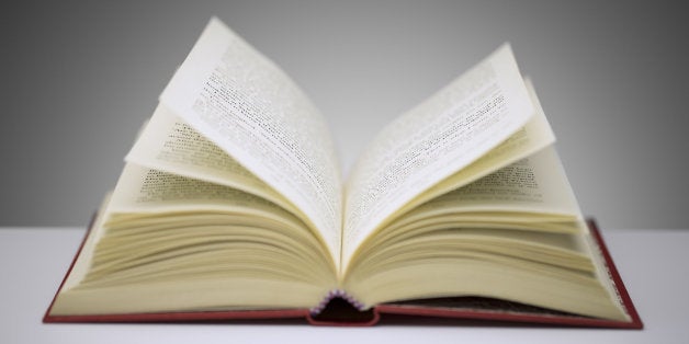 Close up of open book on counter