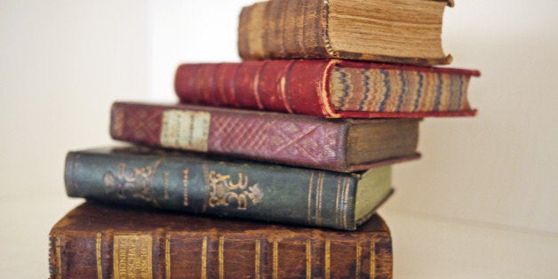 Leather bindings in different colors, gilt spines, marbled edges.