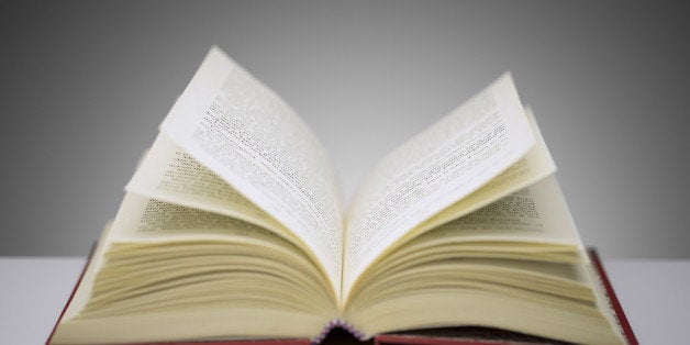 Close up of open book on counter