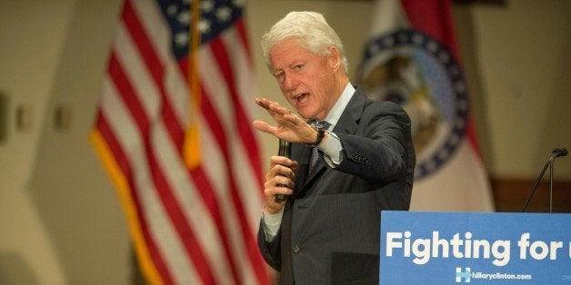 Former US President Bill Clinton speaks to Democratic presidential candidate Hillary Clinton supporters during a rally at the