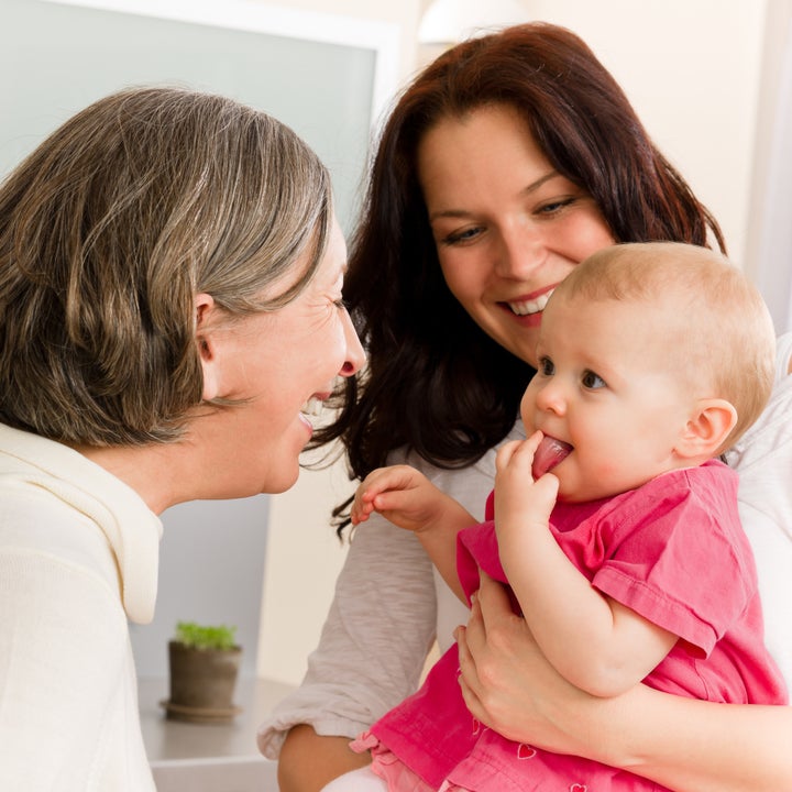 Happy family women - grandmother, mother and baby make funny face