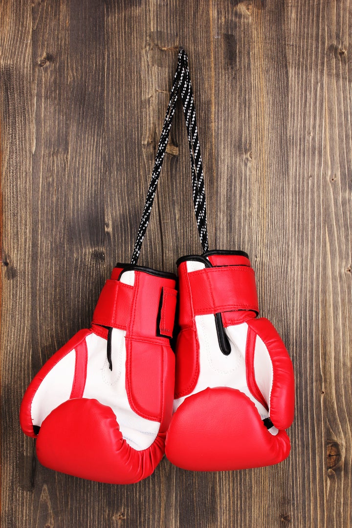 red boxing gloves hanging on...