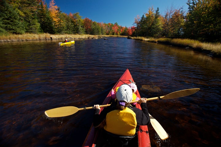 Mother and children kayaking Northeast Creek.