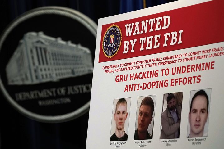 A 'WANTED' poster of Russian individuals is seen during a news conference to announce criminal charges October 4, 2018 in Washington, DC. (Photo by Alex Wong/Getty Images)
