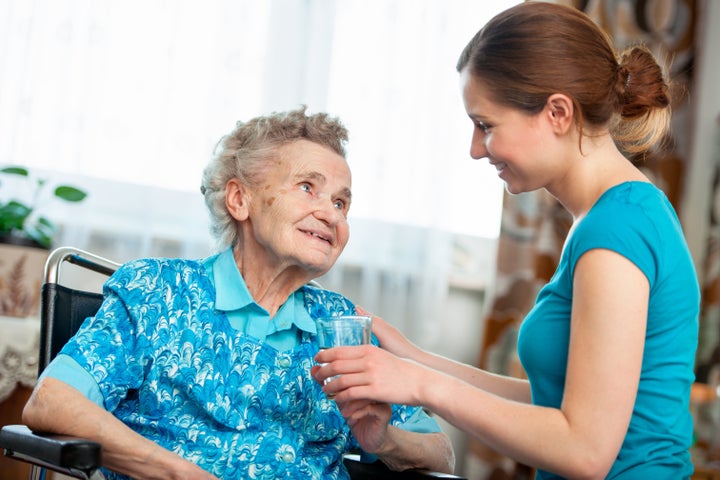 senior woman with her caregiver ...