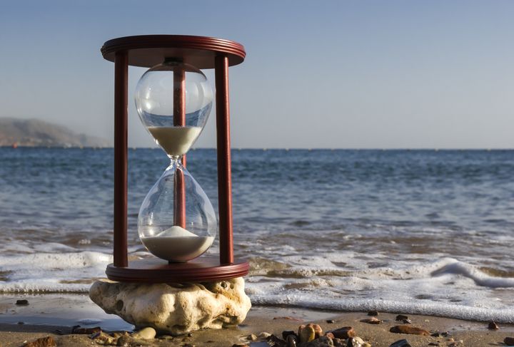 sand clock on a beach ...