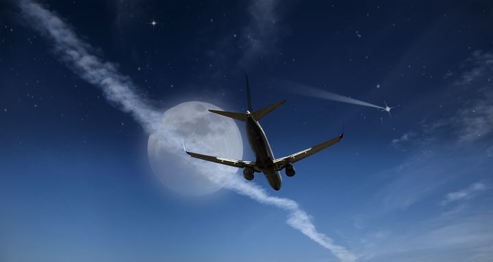 airliner against full moon...