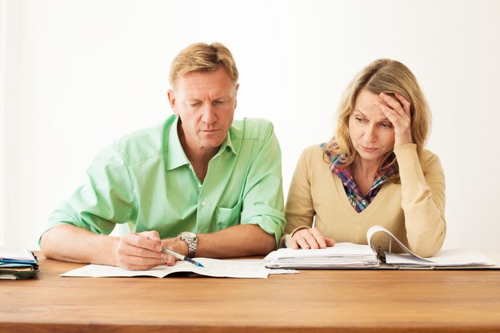 Worried couple going through their finances