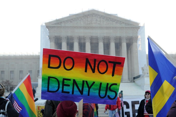 Supporters of same-sex marriage gather in front of the US Supreme Court on March 26, 2013 in Washington, DC. Same-sex marriage takes center stage at the US Supreme Court on Tuesday as the justices begin hearing oral arguments on the emotionally-charged issue that has split the nation. AFP PHOTO/Jewel Samad (Photo credit should read JEWEL SAMAD/AFP/Getty Images)