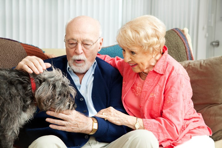 senior couple at home with...