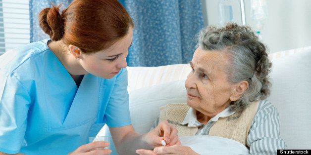 nurse cares for a elderly woman ...