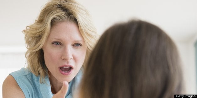 Mother and daughter (8-9 years) arguing