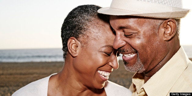 Black couple hugging outdoors