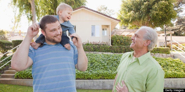 Happy Caucasian grandfather, father and son