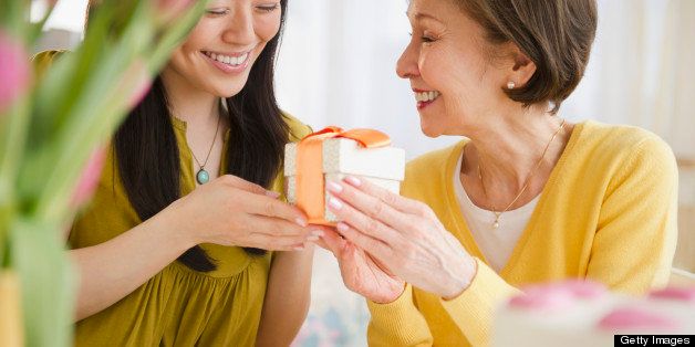 Japanese daughter giving mother gift