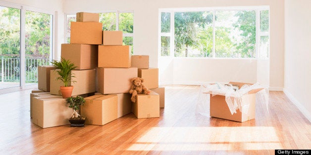 Boxes stacked in living room of new house